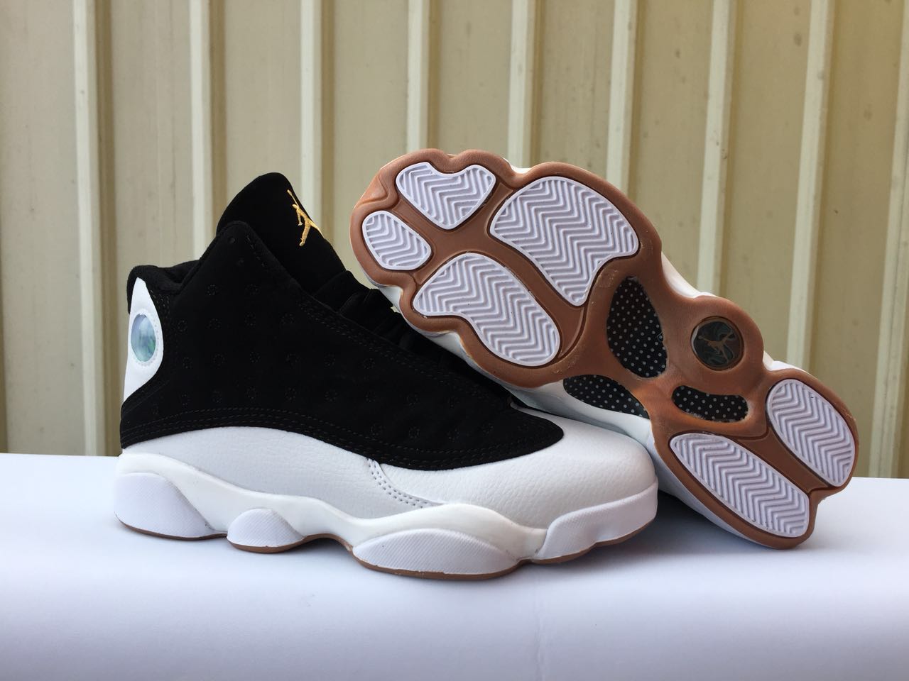gold and white jordans 13