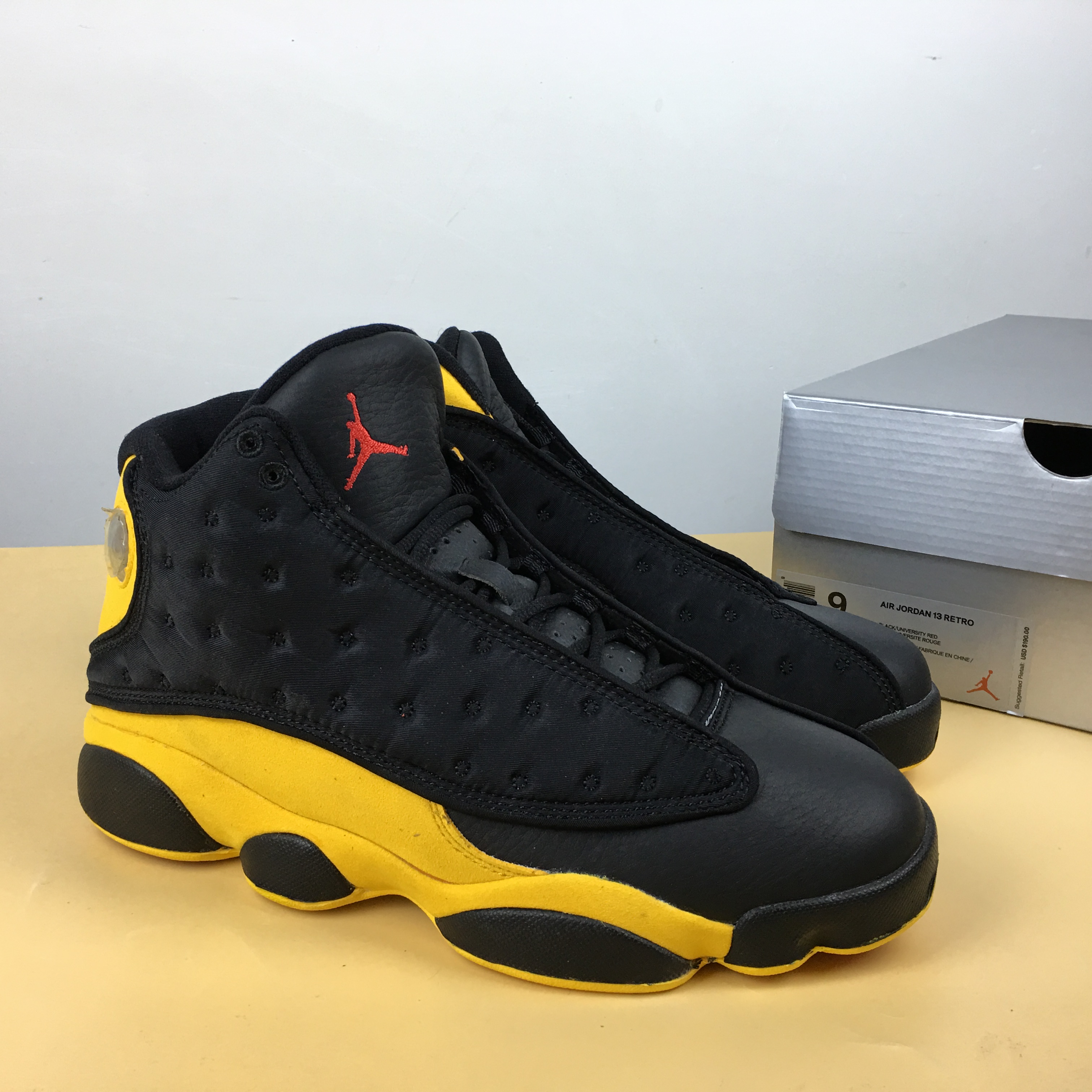 13 jordans black and yellow